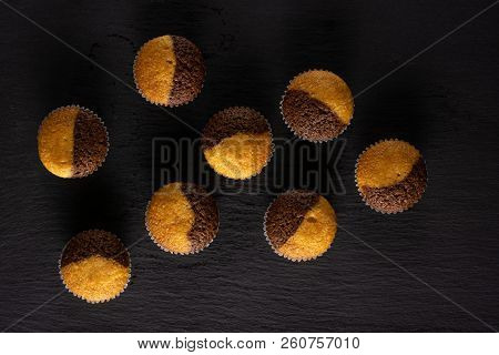 Group Of Eight Whole Fresh Baked Marble Muffin Flatlay On Grey Stone
