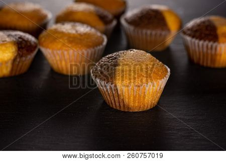 Lot Of Whole Fresh Baked Marble Muffin On Grey Stone