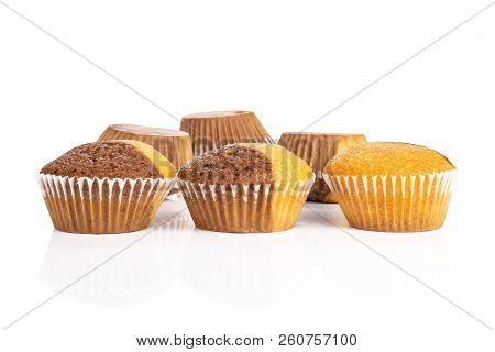 Group Of Six Whole Fresh Baked Marble Muffin Three In Focus Isolated On White Background