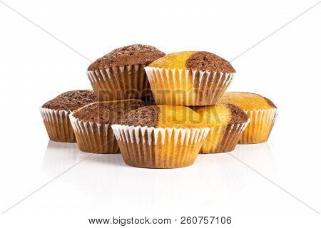 Group Of Seven Whole Fresh Baked Marble Muffin Isolated On White Background