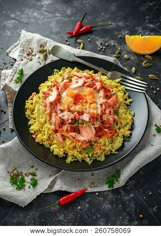 Traditional Indian-english Kedgeree Breakfast: Basmati Rice With Egg Benedict And Hot Smoked Sweet C