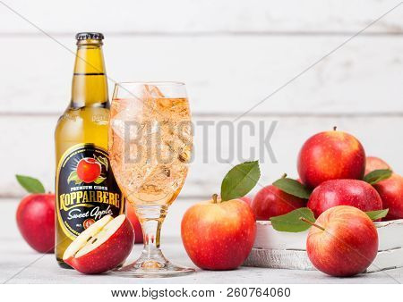 London, Uk - September 13, 2018: Bottle And Glass Of Kopparberg Sweet Apple Cider With Fresh Apples 