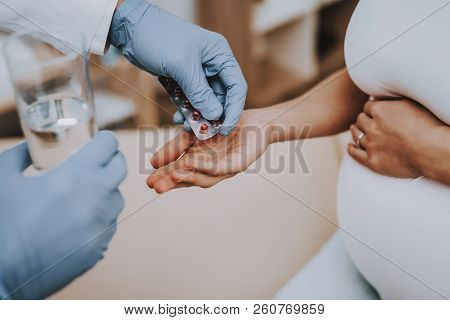 Motherhood. Gives Medicine. Examination. Hospital. Childbirth. Belly. Pregnant Woman. Smiling. Clini