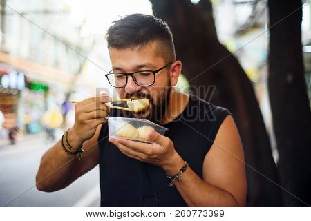 Foreigner Eating Baozi On The Street In China