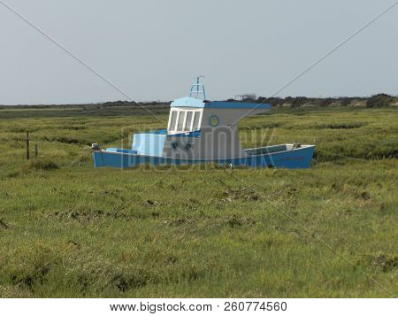 A Relatively New Ship, Anchored In The East Dry Sea Channel, Waiting For The Tide To Fill.