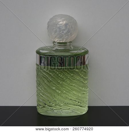 Fragrance For Ladies, Large Perfume Bottle In Front Of A White Background