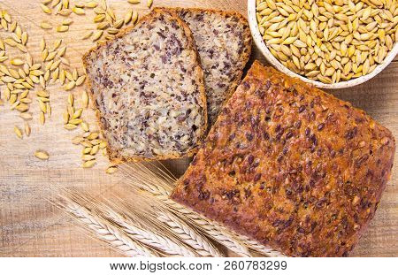 Multi-grain Bread On A Wooden Background. Healthy Food Concept.