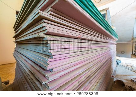Construction Materials And Sheets Of Plasterboard Or Drywall Are Prepared For Working Process Of Ins
