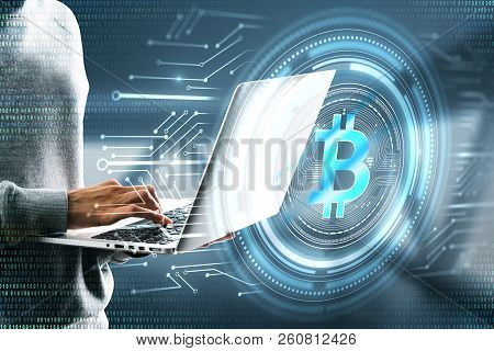 Hacker Using Laptop With Digital Business Interface On Blurry Background. Hacking And Cryptocurrency