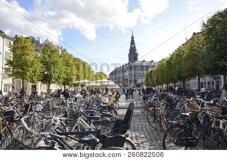 Copenhagen, Denmark - September 15, 2018: Many Bikes Parked At High Bridge Square, With The Equestri