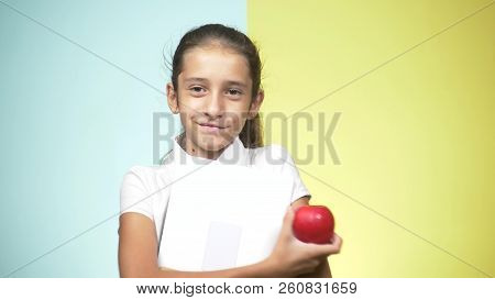 Portraits Of A Teenage Girl In A School Uniform On A Colored Background. Funny Girl. Concept Of Lear