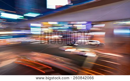 Abstract Blurred View Of People And Traffic Crossing A Busy Intersection In Shibuya, Tokyo, Japan