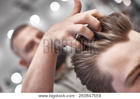 Haircut And Hair Styling In Barbershop. Hair Care. Men's Style And Lifestyle. Barber Brings A Haircu