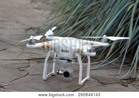 rone quadrocopter Phantom 3 Professional with high resolution digital camera designed by the Chinese company DJI stands on a woodenstone floor close-up photo.September 30, 2018.Near Kiev, Ukraine