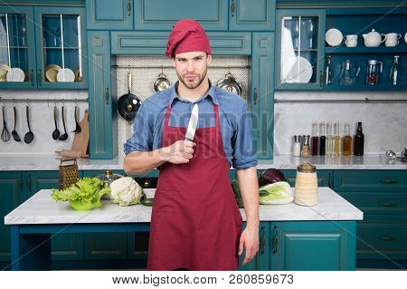 Man Chef Wear Apron Cooking In Kitchen. Man Use Sharp Ceramic Knife. Sharp Knife Professional Tool. 