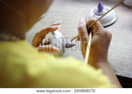 Artist Painting Benjarong Ceramic Ware