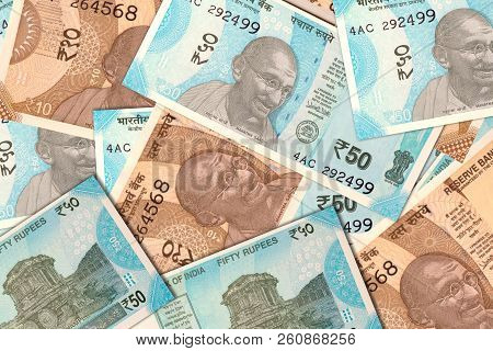 Scattered Indian New 10 And 50 Rupee Currency Notes.