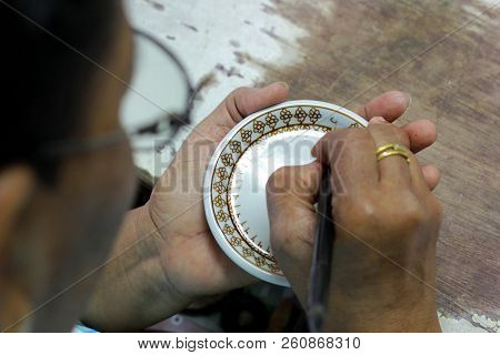Artist Painting Benjarong Ceramic Ware
