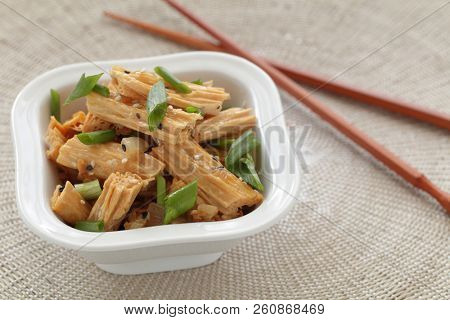 Chinese and Korean yuba salad with green onion and sesame seeds