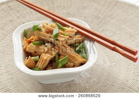 Chinese and Korean yuba salad with green onion and sesame seeds