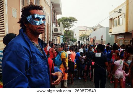 Mindelo, Sao Vicente Island, Cape Verde - Jan 5 2016: Man With A Mask Watching The Carnival Event On