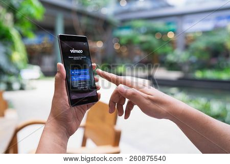 Chiang Mai, Thailand - May 05,2018: Man Holding Huawei With Vimeo On Screen.  Vimeo Is A Video-shari