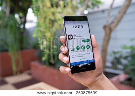 Chiang Mai, Thailand - August 05,2018: Man Holding Huawei With Uber Apps. Uber Is Smartphone App Tra