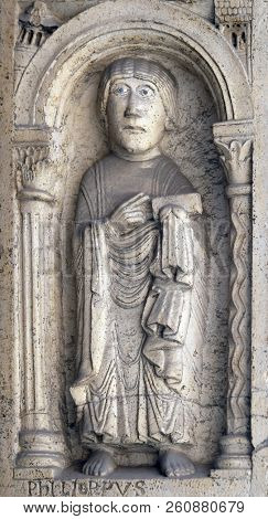 MODENA, ITALY - JUNE 04: Saint Philip the apostle, bass relief by followers of Wiligelmo, Princesâ Gate, Modena Cathedral, Italy on June 04, 2017.