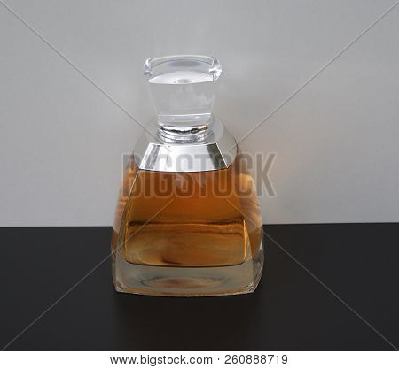 Fragrance For Ladies, Large Perfume Bottle In Front Of A White Background