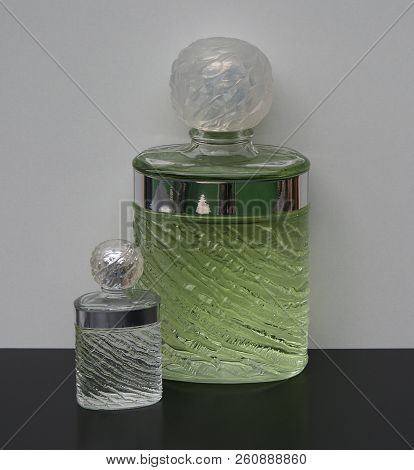 Fragrance For Ladies, Large Perfume Bottle Next To A Commercial Perfume Bottle