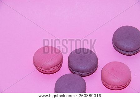 Macaroni On A Gently Pink Background. Delicious Cakes For Tea. Dessert Close-up.