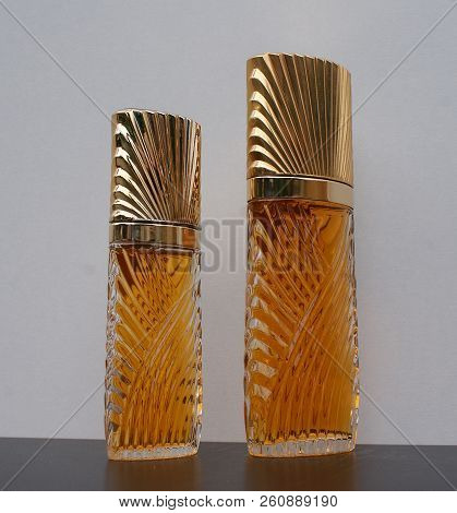 Fragrance For Ladies, Large Perfume Bottle Next To A Commercial Perfume Bottle