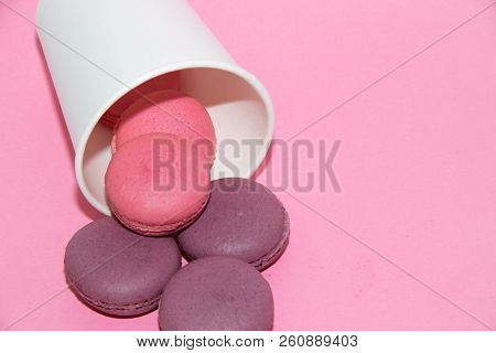 Macaroni On A Gently Pink Background. Delicious Cakes For Tea. Dessert Close-up.