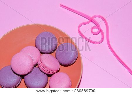 Macaroni On A Gently Pink Background. Delicious Cakes For Tea. Dessert Close-up.