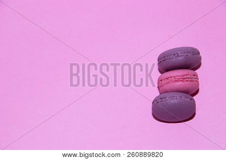 Macaroni On A Gently Pink Background. Delicious Cakes For Tea. Dessert Close-up.