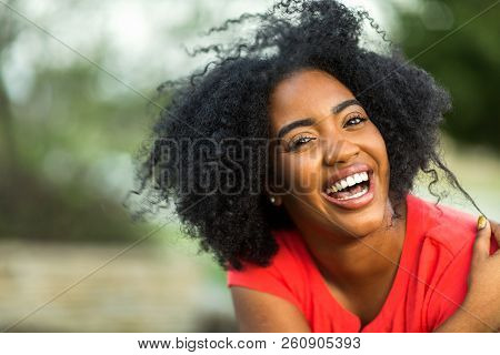Happy Confident African American Woman Smiling Outside.