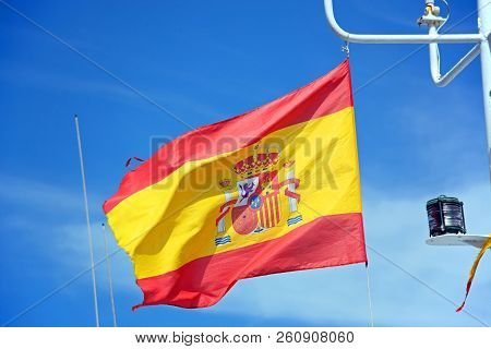Spanish Flag On A Fishing Boat Against A Blue Sky, Ayamonte, Huelva Province, Andalusia, Spain, Euro