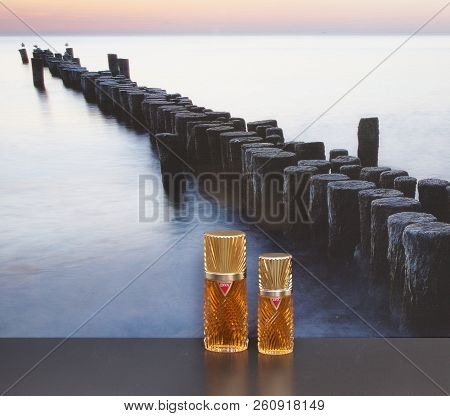 Diva, Fragrance For Ladies, Large Perfume Bottle Next To A Commercial Perfume Bottle In Front Of The