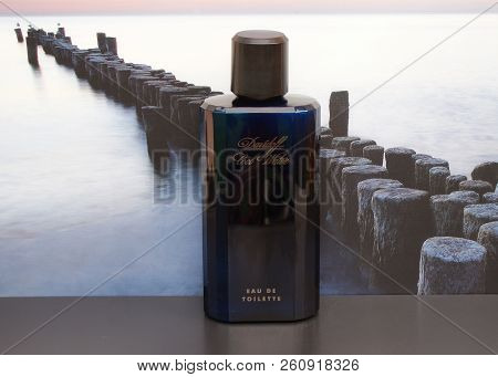 Davidoff Cool Water, Eau De Toilette, Large Perfume Bottle In Front Of The Picture Of A Groyne In Th