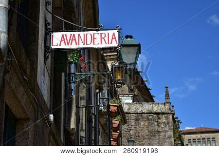 Old Laundry Street Sign.
Vintage Iron Sign Outdoors.