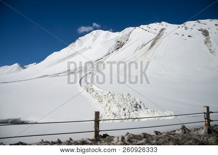 Avalanche Near The Road In The Caucasian Mountains
