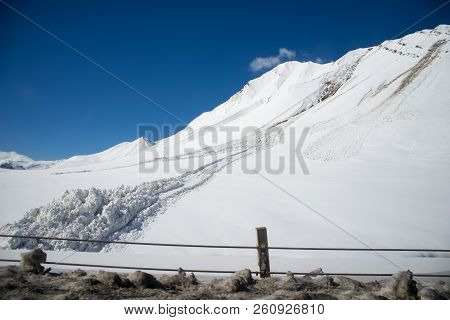 Avalanche Near The Road In The Caucasian Mountains