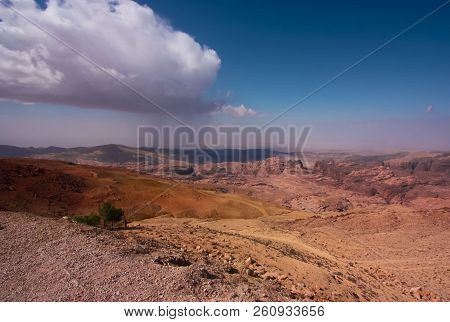 Stunning Landscape Of The Sunny Valley Of The Jordan, Canyon Under Blue Sky, With Big Rainy Cloud. O