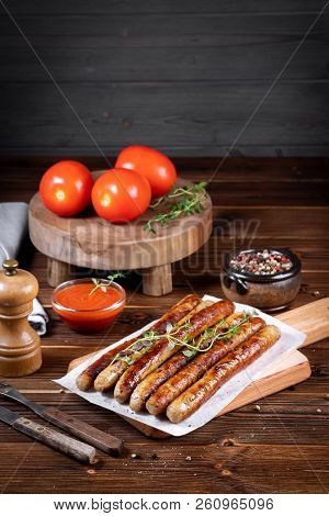 Pork Chipolata. Close-up View Of Fried Sausages. Meat Dish