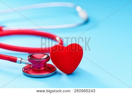 Red Heart And A Stethoscope On On Blue Background.selective Focu