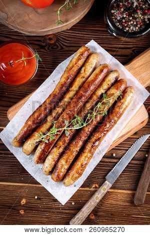 Pork Chipolata. Close-up View Of Fried Sausages. Meat Dish