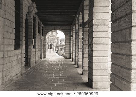 Chioggia, Italy-august 26, 2018: Province Of Venice. Street With An Arch And Columns.