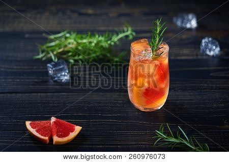 Gin Cocktail With Rosemary And Grapefruit Top View.
