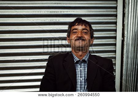 Lankaran, Azerbaijan - Apr 18 2011: Local Man In Front Of His Closed Store Front At The Local Market