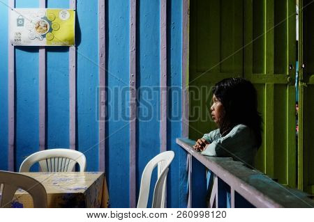 Macedonia, Amazonia / Colombia - Mar 10 2016: Local Indian Young Girl Watching The Tv During The Hot